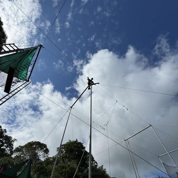 Flying trapeze rig with panoramic valley and sky views