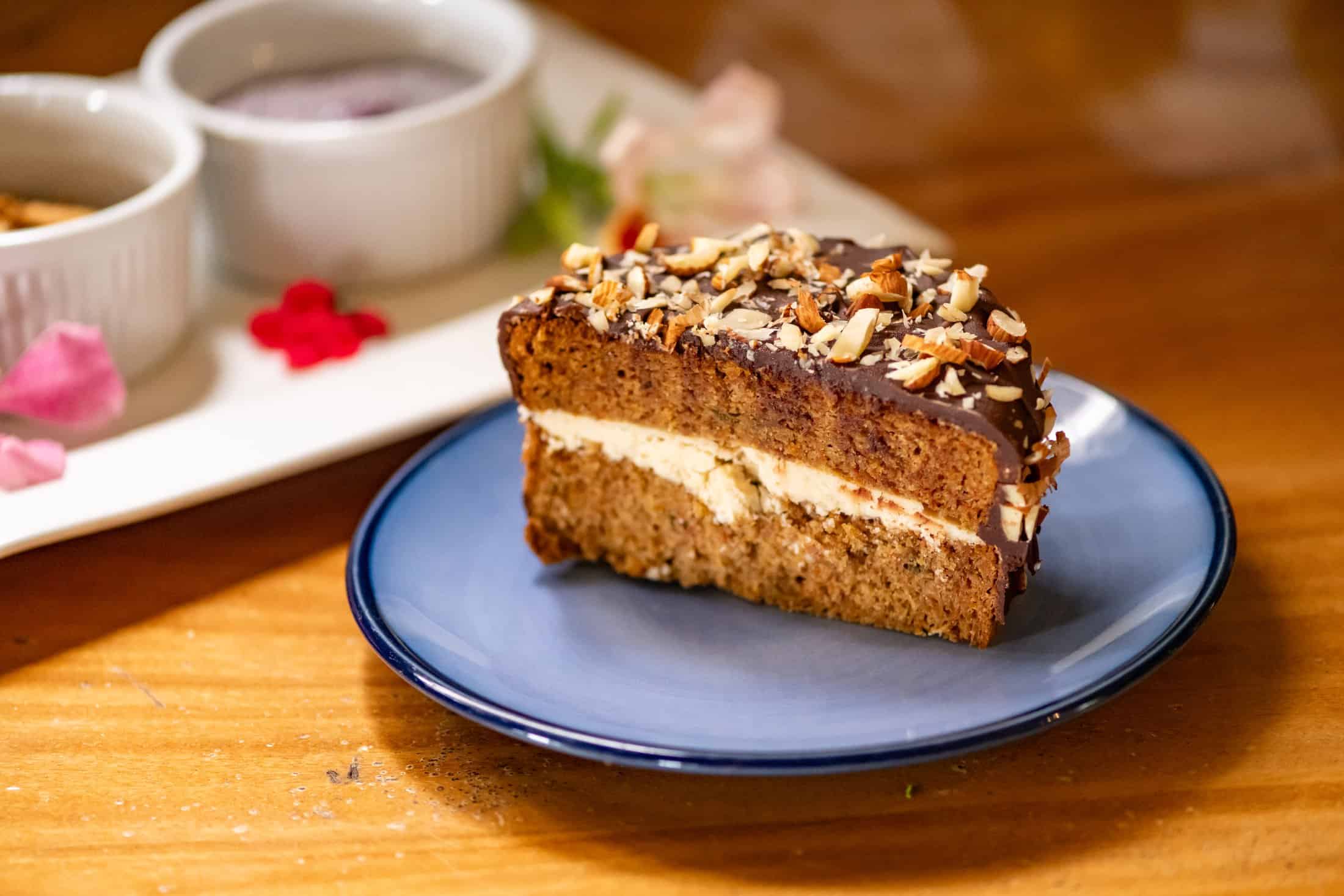 Chocolate hazelnut layer cake on a hand-thrown blue ceramic plate at Airborne Arts