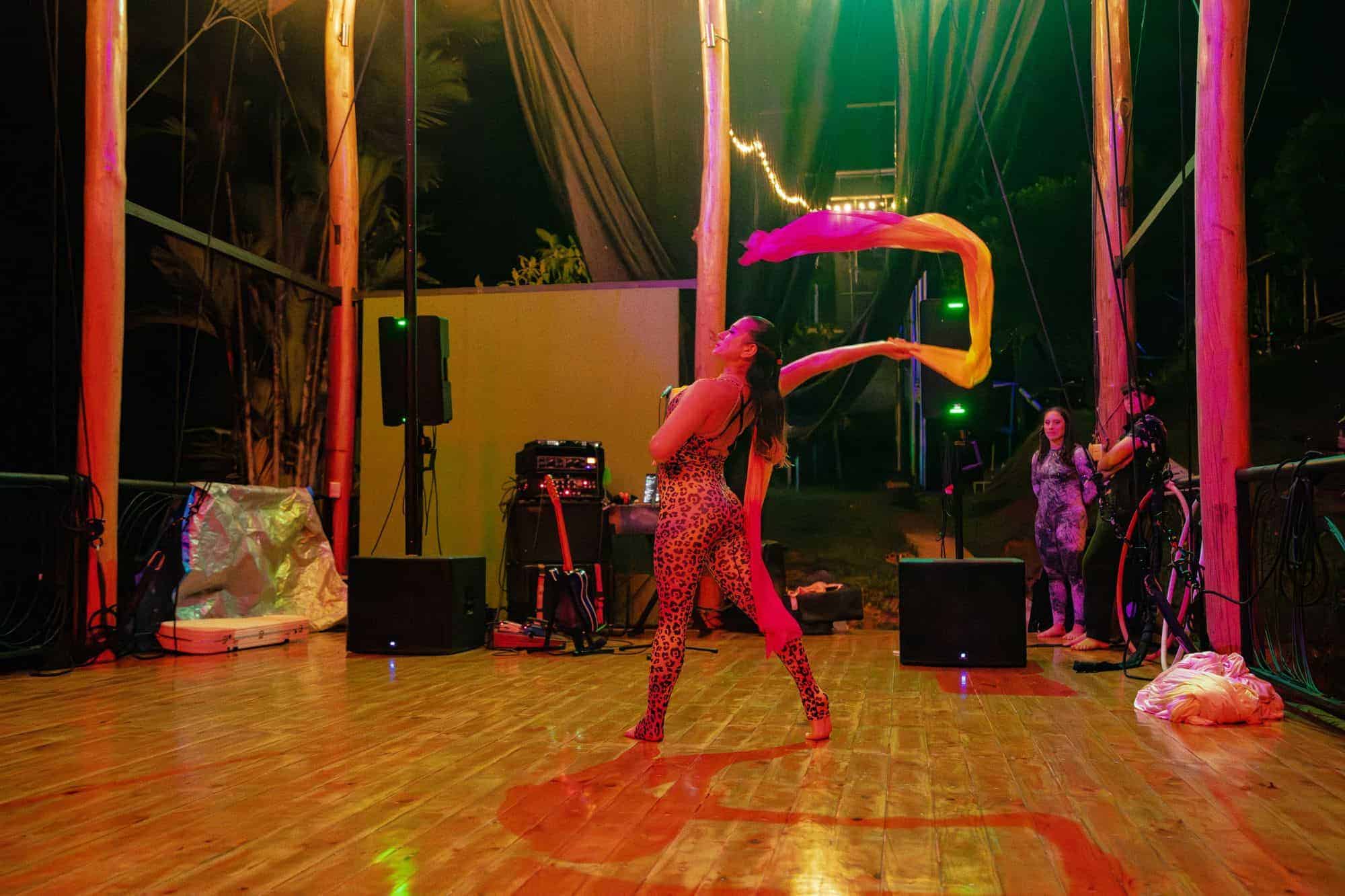 Aerialists training on silks in the open-air studio above the jungle valley at Airborne Arts Costa Rica