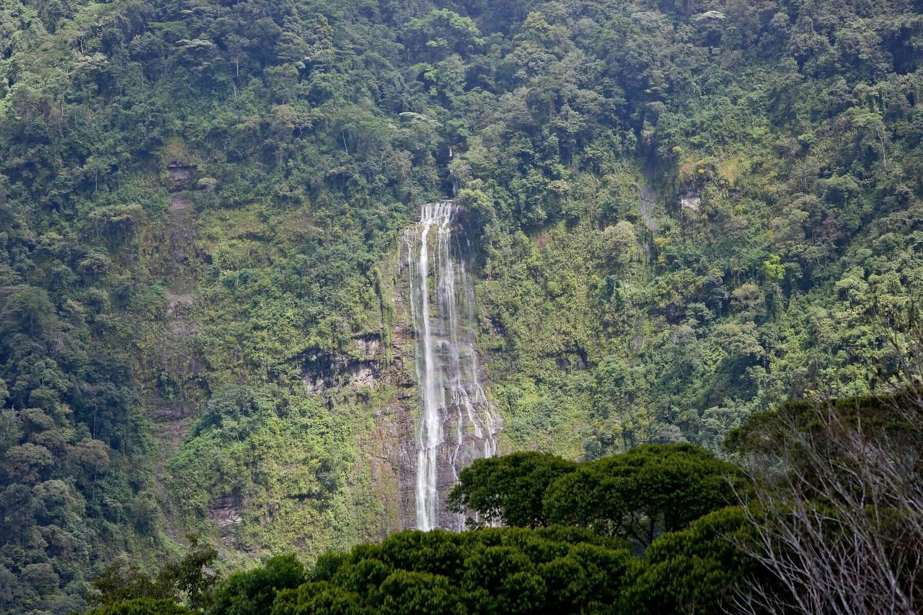 Aerial view of Diamante Falls, an 1,800-foot waterfall cascading through the rainforest near Airborne Arts Costa Rica